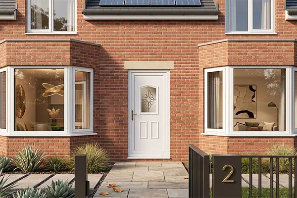 White uPVC door on house with bay windows